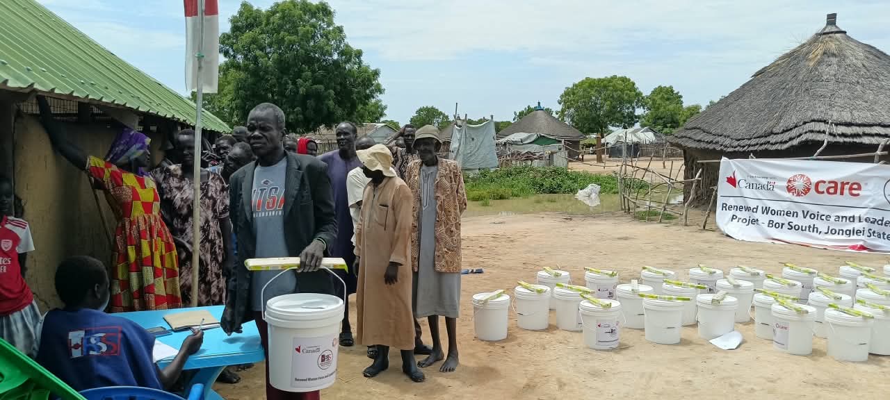 A participant collects a bucket after registering with an HRSS staff member.
