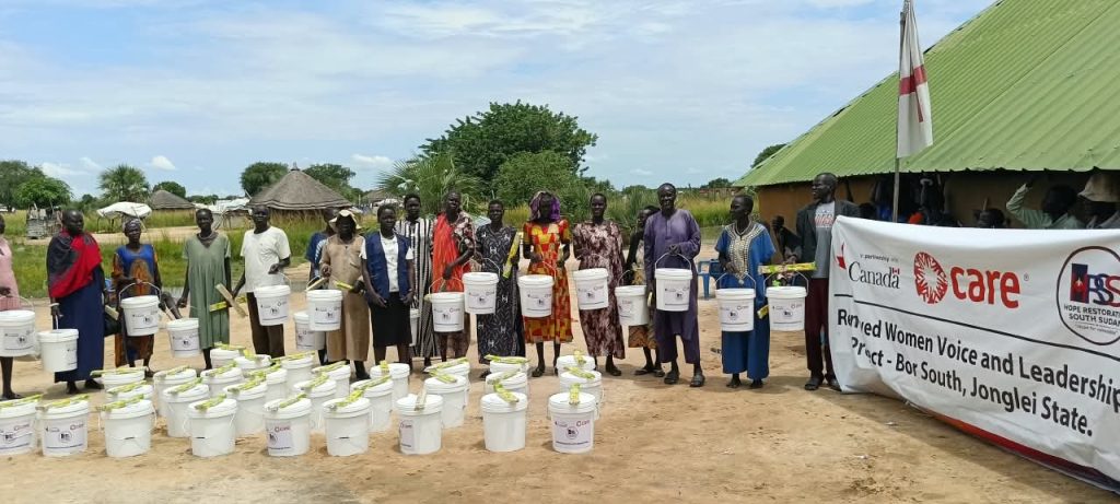 Participants with their WASH items at the Bor Stadium IDP site, South Sudan, 15 October 2026.
