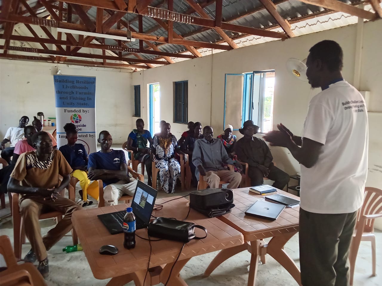 HRSS facilitator presenting to AAP committee members in Leer County